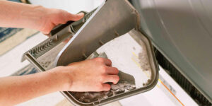 Removing Lint from Inside the Whirlpool Duet Dryer Cabinet - Supreme Air Duct Cleaning Austin